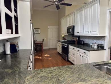 One or more photo(s) has been virtually staged. One or more on University Park Country Club in Florida - for sale on GolfHomes.com, golf home, golf lot