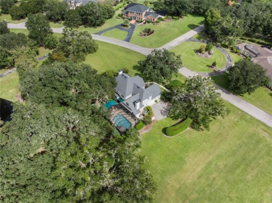 Under contract-accepting backup offers. Stunning custom home on Turkey Creek Golf and Country Club in Florida - for sale on GolfHomes.com, golf home, golf lot