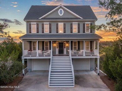 Nestled on approximately 1.4 acres at the end of a quiet on Members Club At St. James Plantation in North Carolina - for sale on GolfHomes.com, golf home, golf lot