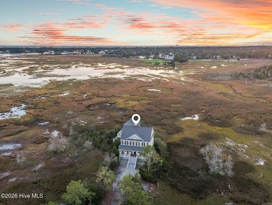 Nestled on approximately 1.4 acres at the end of a quiet on Members Club At St. James Plantation in North Carolina - for sale on GolfHomes.com, golf home, golf lot