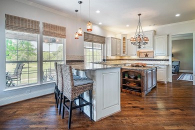 Prepare to be captivated by breathtaking golf and water vistas on Hackberry Creek Country Club in Texas - for sale on GolfHomes.com, golf home, golf lot