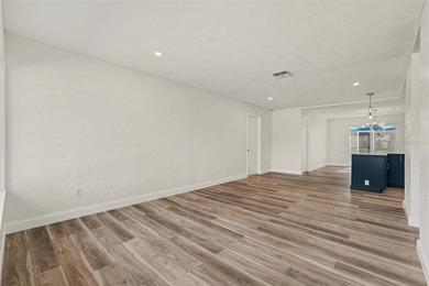 Some photos are Virtually Staged. Refined Coastal Elegance of on St. Petersburg Country Club in Florida - for sale on GolfHomes.com, golf home, golf lot