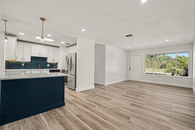 Some photos are Virtually Staged. Refined Coastal Elegance of on St. Petersburg Country Club in Florida - for sale on GolfHomes.com, golf home, golf lot