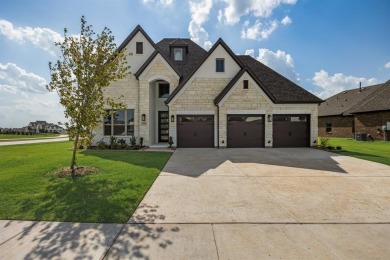 This highly sought-after single-story Altura Aspen floorplan is on Heath Golf and Yacht Club in Texas - for sale on GolfHomes.com, golf home, golf lot