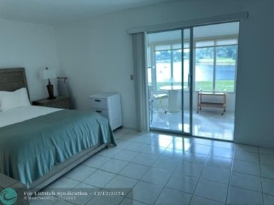 LOOK NO FURTHER , THIS IS IT! WHAT A LAKE VIEW THIS UNIT HAS on Hillsboro Pines Golf in Florida - for sale on GolfHomes.com, golf home, golf lot
