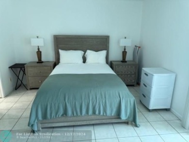 LOOK NO FURTHER , THIS IS IT! WHAT A LAKE VIEW THIS UNIT HAS on Hillsboro Pines Golf in Florida - for sale on GolfHomes.com, golf home, golf lot