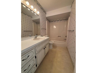 2nd Floor End Unit with Gorgeous, unobstructed Water & Golf on Pine Lakes Golf Club in Florida - for sale on GolfHomes.com, golf home, golf lot