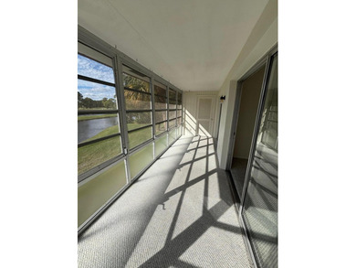 2nd Floor End Unit with Gorgeous, unobstructed Water & Golf on Pine Lakes Golf Club in Florida - for sale on GolfHomes.com, golf home, golf lot