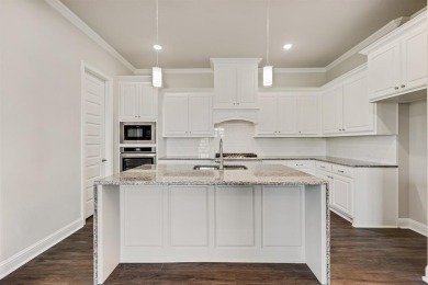 This highly sought-after single-story Altura Aspen floorplan is on Heath Golf and Yacht Club in Texas - for sale on GolfHomes.com, golf home, golf lot