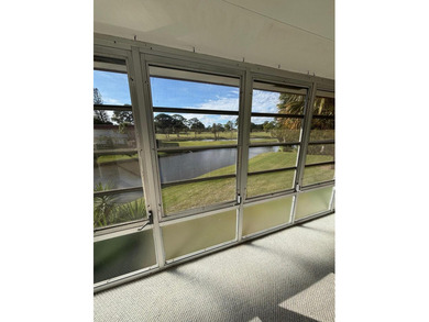 2nd Floor End Unit with Gorgeous, unobstructed Water & Golf on Pine Lakes Golf Club in Florida - for sale on GolfHomes.com, golf home, golf lot