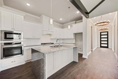 This highly sought-after single-story Altura Aspen floorplan is on Heath Golf and Yacht Club in Texas - for sale on GolfHomes.com, golf home, golf lot