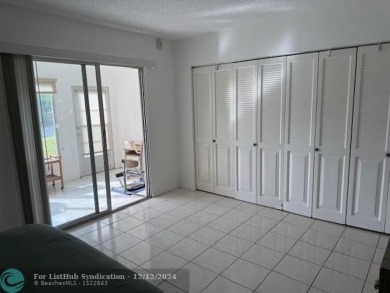 LOOK NO FURTHER , THIS IS IT! WHAT A LAKE VIEW THIS UNIT HAS on Hillsboro Pines Golf in Florida - for sale on GolfHomes.com, golf home, golf lot