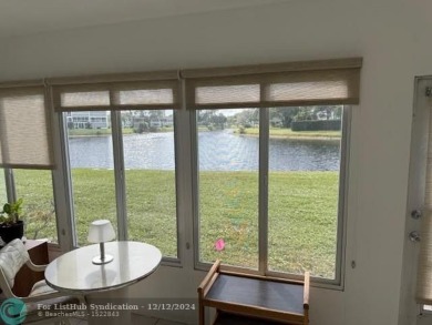 LOOK NO FURTHER , THIS IS IT! WHAT A LAKE VIEW THIS UNIT HAS on Hillsboro Pines Golf in Florida - for sale on GolfHomes.com, golf home, golf lot