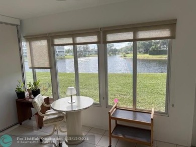 LOOK NO FURTHER , THIS IS IT! WHAT A LAKE VIEW THIS UNIT HAS on Hillsboro Pines Golf in Florida - for sale on GolfHomes.com, golf home, golf lot
