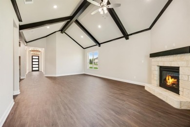 This highly sought-after single-story Altura Aspen floorplan is on Heath Golf and Yacht Club in Texas - for sale on GolfHomes.com, golf home, golf lot