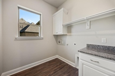 This highly sought-after single-story Altura Aspen floorplan is on Heath Golf and Yacht Club in Texas - for sale on GolfHomes.com, golf home, golf lot