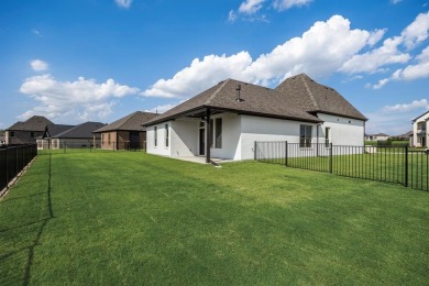 This highly sought-after single-story Altura Aspen floorplan is on Heath Golf and Yacht Club in Texas - for sale on GolfHomes.com, golf home, golf lot