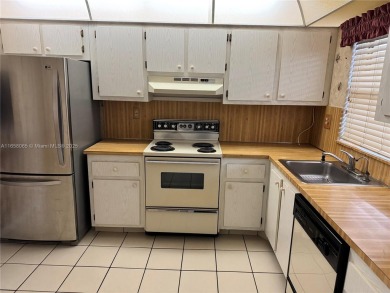 REDUCED TO SELL- LOWEST PRICED 2/1.5 
 Fabulous condo in PHASE on Sunrise Lakes Phase IV Golf Course in Florida - for sale on GolfHomes.com, golf home, golf lot