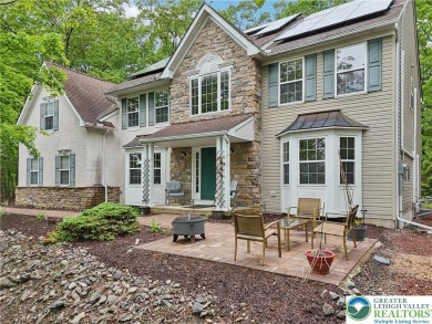 Perched atop a scenic hilltop, 136 Outlook Court offers a unique on Country Club of the Poconos Golf Course in Pennsylvania - for sale on GolfHomes.com, golf home, golf lot
