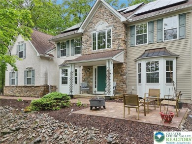 Perched atop a scenic hilltop, 136 Outlook Court offers a unique on Country Club of the Poconos Golf Course in Pennsylvania - for sale on GolfHomes.com, golf home, golf lot