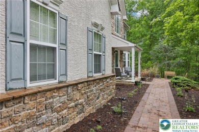 Perched atop a scenic hilltop, 136 Outlook Court offers a unique on Country Club of the Poconos Golf Course in Pennsylvania - for sale on GolfHomes.com, golf home, golf lot