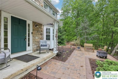 Perched atop a scenic hilltop, 136 Outlook Court offers a unique on Country Club of the Poconos Golf Course in Pennsylvania - for sale on GolfHomes.com, golf home, golf lot