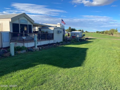 Location at it's BEST! Enjoy the large deck over looking the on Juniper Ridge R.V. Golf Resort in Arizona - for sale on GolfHomes.com, golf home, golf lot