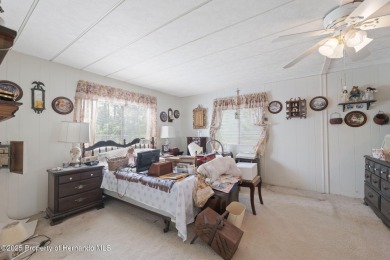 This 2 bedroom, 2 bath home with a covered carport wraps you in on High Point Golf Club, Inc. in Florida - for sale on GolfHomes.com, golf home, golf lot