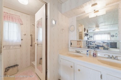 This 2 bedroom, 2 bath home with a covered carport wraps you in on High Point Golf Club, Inc. in Florida - for sale on GolfHomes.com, golf home, golf lot