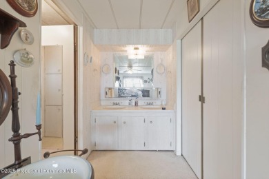 This 2 bedroom, 2 bath home with a covered carport wraps you in on High Point Golf Club, Inc. in Florida - for sale on GolfHomes.com, golf home, golf lot