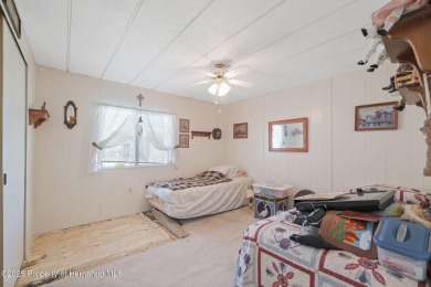 This 2 bedroom, 2 bath home with a covered carport wraps you in on High Point Golf Club, Inc. in Florida - for sale on GolfHomes.com, golf home, golf lot