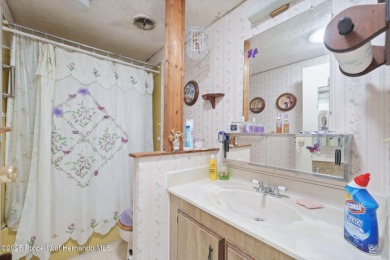 This 2 bedroom, 2 bath home with a covered carport wraps you in on High Point Golf Club, Inc. in Florida - for sale on GolfHomes.com, golf home, golf lot