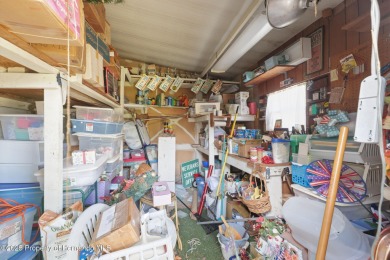 This 2 bedroom, 2 bath home with a covered carport wraps you in on High Point Golf Club, Inc. in Florida - for sale on GolfHomes.com, golf home, golf lot