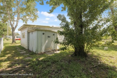 This 2 bedroom, 2 bath home with a covered carport wraps you in on High Point Golf Club, Inc. in Florida - for sale on GolfHomes.com, golf home, golf lot