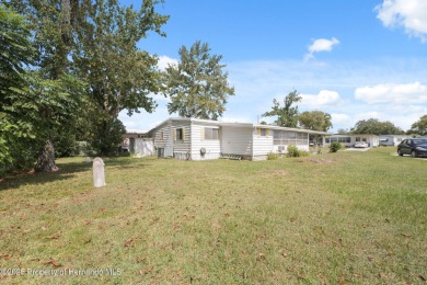 This 2 bedroom, 2 bath home with a covered carport wraps you in on High Point Golf Club, Inc. in Florida - for sale on GolfHomes.com, golf home, golf lot