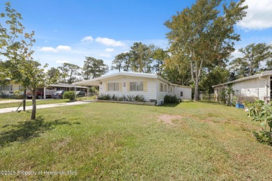 This 2 bedroom, 2 bath home with a covered carport wraps you in on High Point Golf Club, Inc. in Florida - for sale on GolfHomes.com, golf home, golf lot
