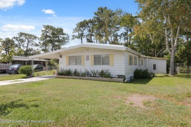 This 2 bedroom, 2 bath home with a covered carport wraps you in on High Point Golf Club, Inc. in Florida - for sale on GolfHomes.com, golf home, golf lot