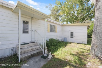This 2 bedroom, 2 bath home with a covered carport wraps you in on High Point Golf Club, Inc. in Florida - for sale on GolfHomes.com, golf home, golf lot