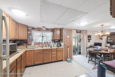 This 2 bedroom, 2 bath home with a covered carport wraps you in on High Point Golf Club, Inc. in Florida - for sale on GolfHomes.com, golf home, golf lot