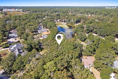 Perfect location to build your coastal home.  Level lot with on Oyster Bay Golf Links in North Carolina - for sale on GolfHomes.com, golf home, golf lot