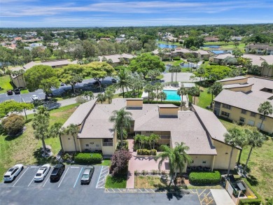 Welcome to your dream condo in the sought-after community of on Woodmont Country Club in Florida - for sale on GolfHomes.com, golf home, golf lot