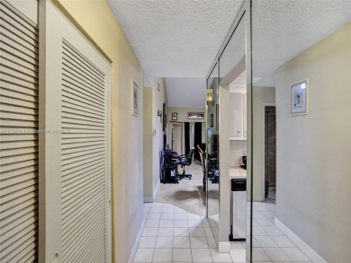 Welcome to your dream condo in the sought-after community of on Woodmont Country Club in Florida - for sale on GolfHomes.com, golf home, golf lot