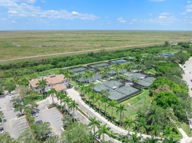 Welcome to this stunning 5-bed, 3.5-bth home with a private pool on Heron Bay Golf Club in Florida - for sale on GolfHomes.com, golf home, golf lot