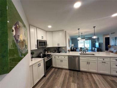 One of the BEST condo remodels in Isla Del Sol!  Photos do not on Isla Del Sol Yacht and Country Club in Florida - for sale on GolfHomes.com, golf home, golf lot