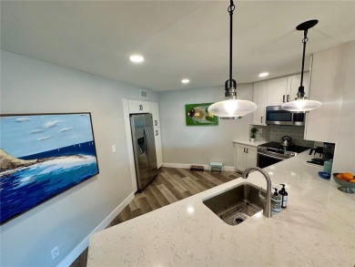 One of the BEST condo remodels in Isla Del Sol!  Photos do not on Isla Del Sol Yacht and Country Club in Florida - for sale on GolfHomes.com, golf home, golf lot