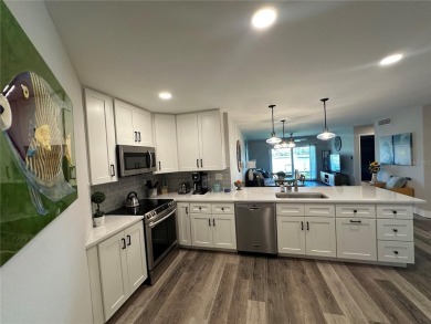 One of the BEST condo remodels in Isla Del Sol!  Photos do not on Isla Del Sol Yacht and Country Club in Florida - for sale on GolfHomes.com, golf home, golf lot