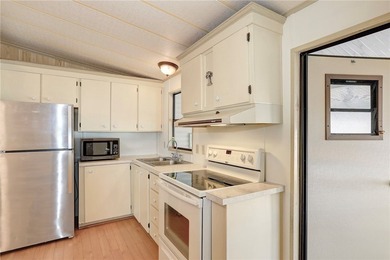 Just a short walk to the golf course, this well-maintained home on Barefoot Bay Golf Course in Florida - for sale on GolfHomes.com, golf home, golf lot