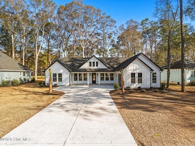 Beautiful black and white farmhouse home located across from the on  in North Carolina - for sale on GolfHomes.com, golf home, golf lot