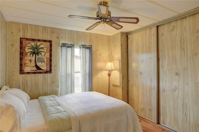 Just a short walk to the golf course, this well-maintained home on Barefoot Bay Golf Course in Florida - for sale on GolfHomes.com, golf home, golf lot