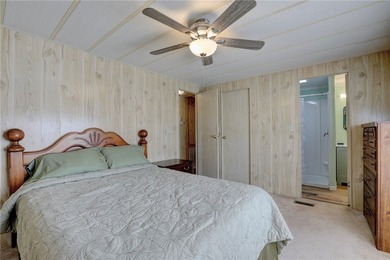 Just a short walk to the golf course, this well-maintained home on Barefoot Bay Golf Course in Florida - for sale on GolfHomes.com, golf home, golf lot